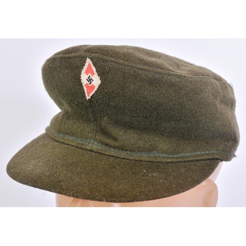 194 - A WWII Second World War Third Reich Nazi German Hitler Youth cap and a Reich Protection League armba... 