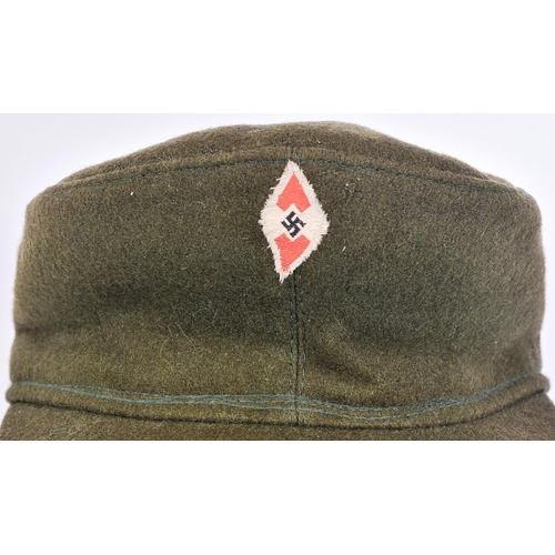 194 - A WWII Second World War Third Reich Nazi German Hitler Youth cap and a Reich Protection League armba... 