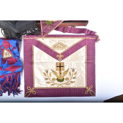 197 - An original Masonic Knights Templar uniform regalia comprising mantle and tunic, maroon velvet cap, ... 