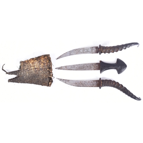 22 - A 19th Century Sudanese Mahdist People triple knife dagger. Three daggers housed within a Nile skin ... 