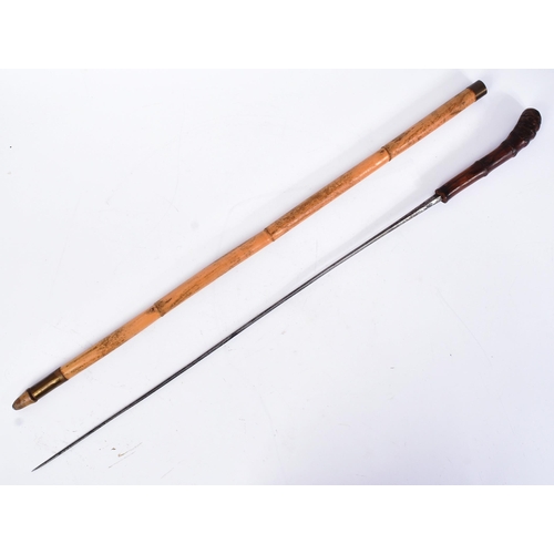 202 - A 19th Century Continental sword stick / walking stick with concealed blade. The cane with a knotted... 