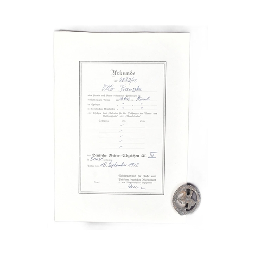 203 - A WWII Second World War Third Reich Nazi German Equestrian / Horseman's badge with certificate. A br... 