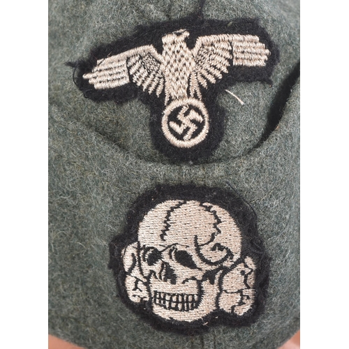 211 - A WWII Second World War style Third Reich Nazi German Waffen SS enlisted mans side cap. The cap with... 