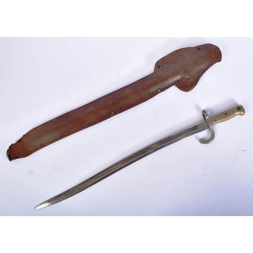 214 - A 19th Century French 1866 pattern ' Chassepot ' rifle bayonet. The bayonet having ribbed brass hilt... 