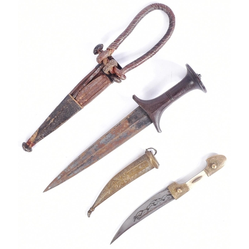 221 - Two late 19th Century ethnic knives / daggers comprising an African / Sudanese dagger with waisted w... 