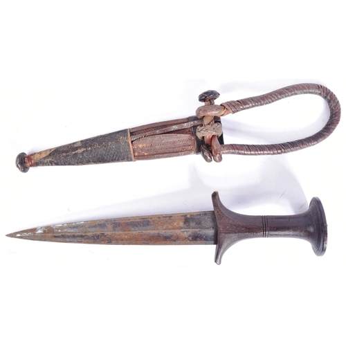 221 - Two late 19th Century ethnic knives / daggers comprising an African / Sudanese dagger with waisted w... 