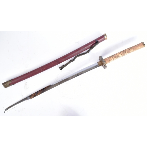 226 - A 20th Century Japanese Katana / Samurai sword with a hidden knife. Brass capped pommel with a carve... 