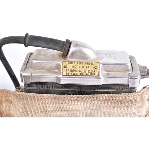 234 - Two vintage British coal mining headlamps with battery packs and an MSA Self Rescue Respirator. The ... 