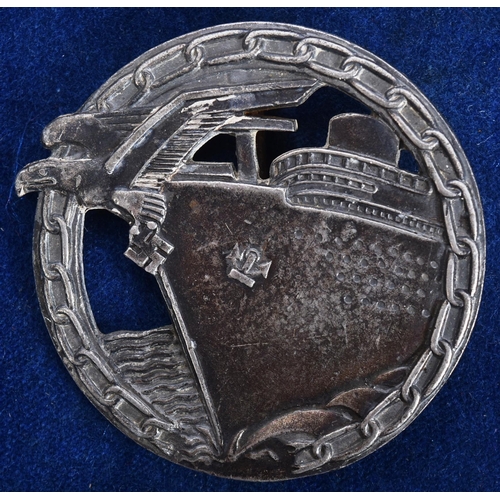 246 - A WWII Second World War Third Reich Nazi German Kriegsmarine Blockade Runners badge. The badge depic... 