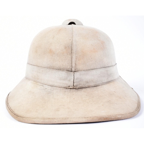 252 - An original WWII Second World War British Army Wolseley pattern tropical pith helmet. Lacking the li... 