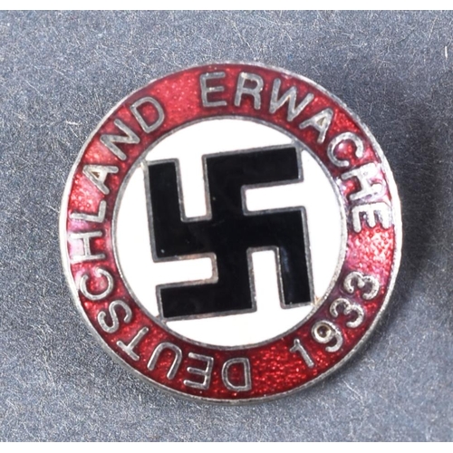 254 - A collection of x3 post-WWII Second World War British and German far right / fascist badges comprisi... 