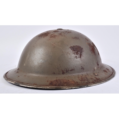 255 - A WWII Second World War British Army MK II Helmet. The insignia to the front being that of the Irish... 