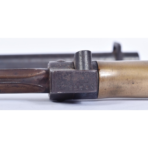 266 - An original 19th Century French M1886 Lebel rifle bayonet. The bayonet having a smooth brass grip wi... 