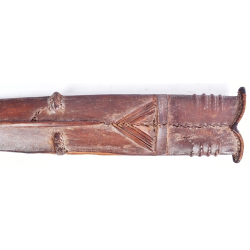 34 - An early 20th Century Central African Congolese Salampasu Sword. Carved wooden hilt and a double edg... 