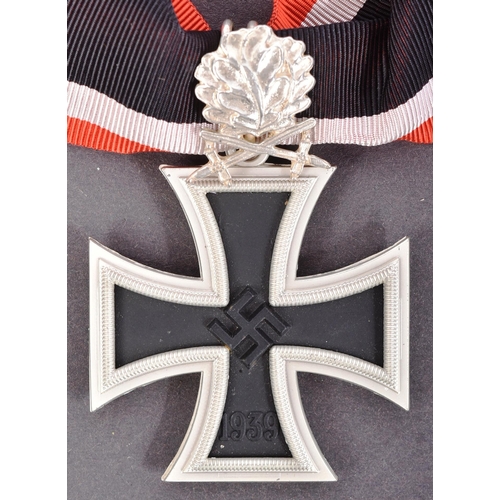 311 - A WWII Second World War style Third Reich Nazi German Iron Cross with oakleaves. A replica example w... 