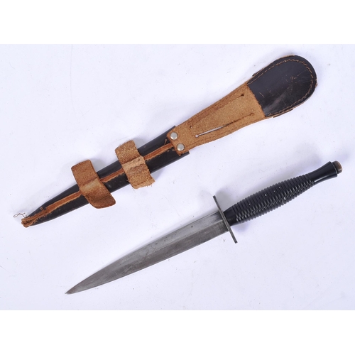 327 - A post WWII Second World War third pattern FS Fairbairn Sykes fighting knife. Typical form with bras... 