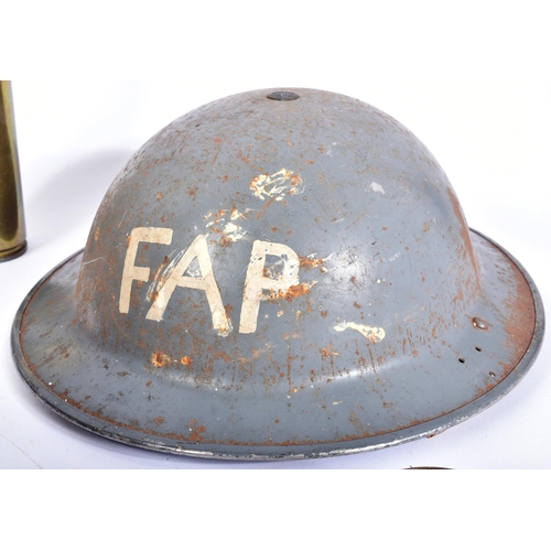 329 - A collection of WWII Second World War British Military items comprising; FAP First Aid Party brodie ... 