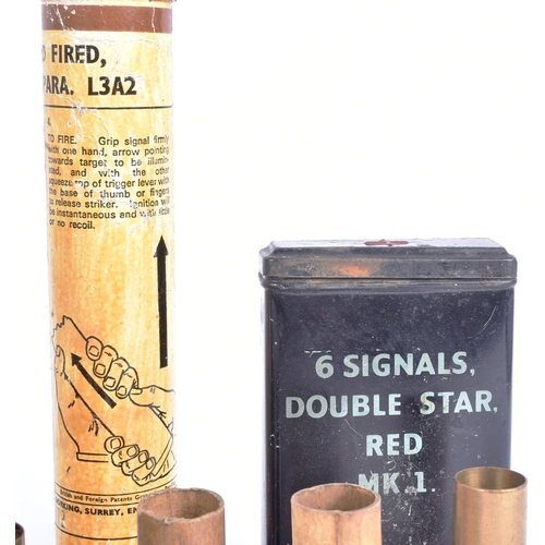 338 - A collection of WWI First and WWII Second World War flare cartridges, x2 1945 dated signal tins, x2 ... 