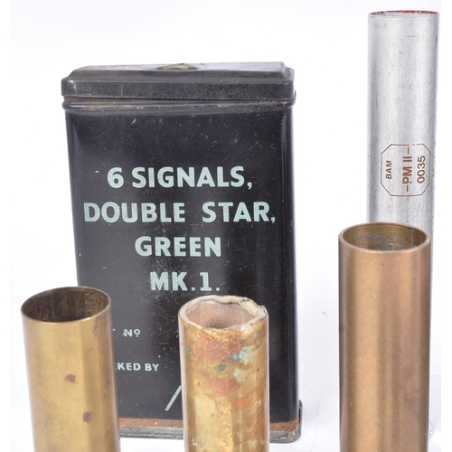 338 - A collection of WWI First and WWII Second World War flare cartridges, x2 1945 dated signal tins, x2 ... 