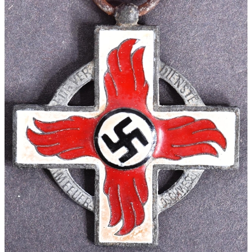 382 - A WWII Second World War Third Reich Nazi German Officers Fire Brigade Cross medal. Red and white ena... 