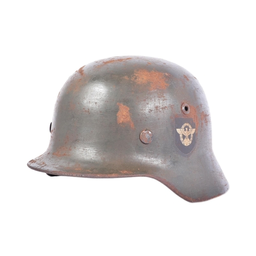 455 - A WWII Second World War Third Reich Nazi German M35 Police helmet. Double decal example with a wreat... 