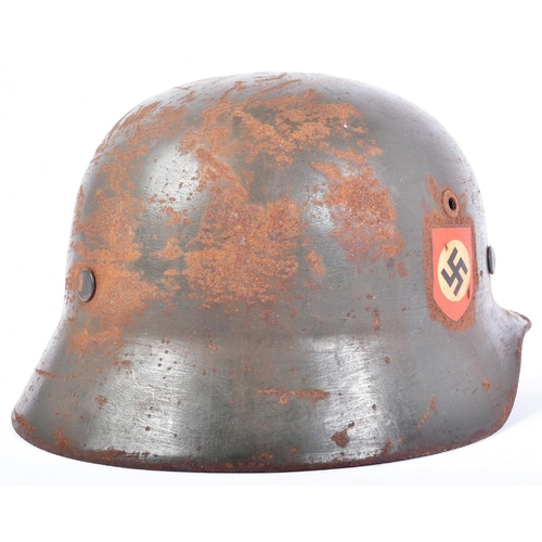 455 - A WWII Second World War Third Reich Nazi German M35 Police helmet. Double decal example with a wreat... 