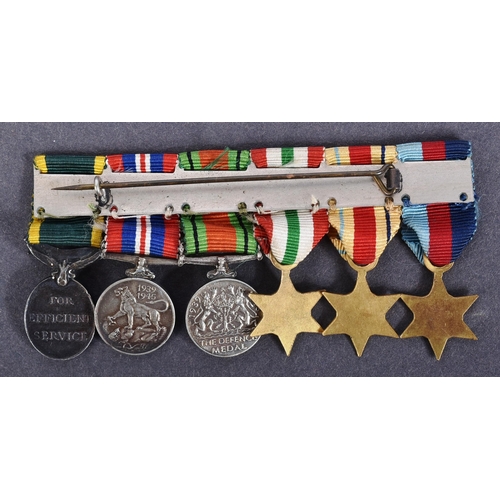 52 - A WWII Second World War miniature medal group suspended on original ribbons and mounted onto a bar. ... 