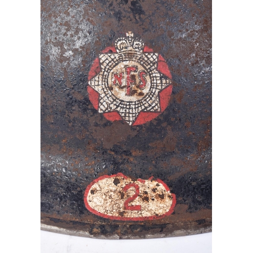 57 - A WWII Second World War British National Fire Service brodie helmet. The helmet of usual form with h... 