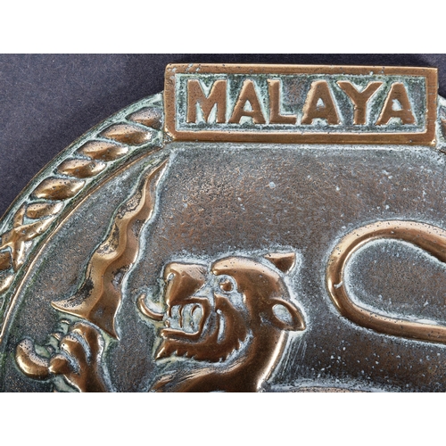 63 - HMS Malaya - a bronze roundel depicting the ship's emblem, with Latin motto ' Mallum Fero Malis' to ... 