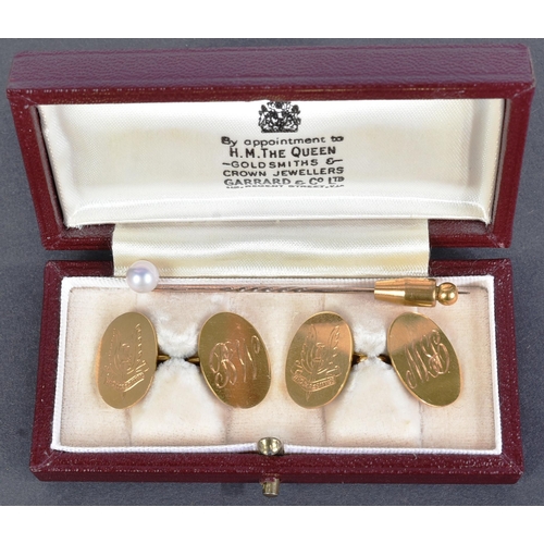 499 - A 9ct gold hallmarked set of cufflinks, engraved to one side with the SAS 'Who Dares Wins' motto and... 