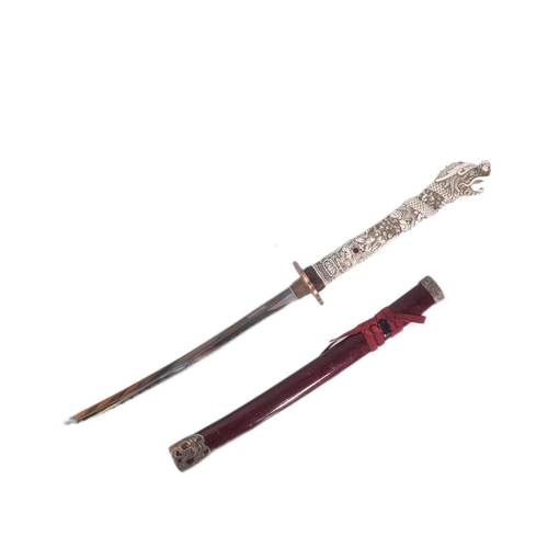 66 - A 20th Century Japanese style Katana / Samurai sword. The celluloid hilt with a pommel in the form o... 