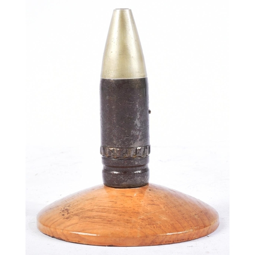 78 - A vintage Gulf War era 30mm Apache cannon round. The inert ammunition with applied brass badge and m... 