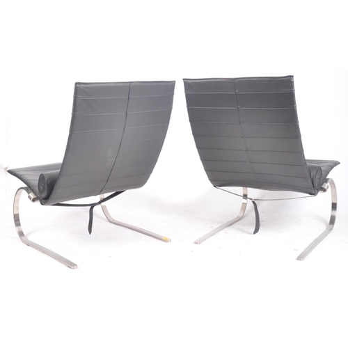 100 - After Poul Kjaerholm, pair of black leather and polished steel PK20 armchairs / chairs, raised on st... 