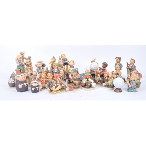 127 - M. J. Hummel by Goebel - A large collection of vintage 20th century Goebel porcelain china figurines... 