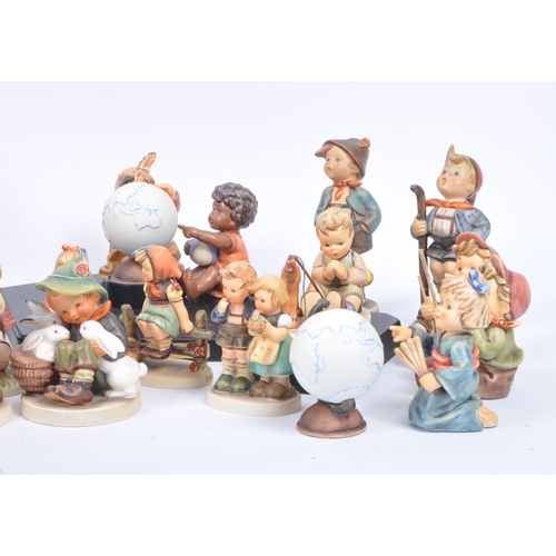 127 - M. J. Hummel by Goebel - A large collection of vintage 20th century Goebel porcelain china figurines... 