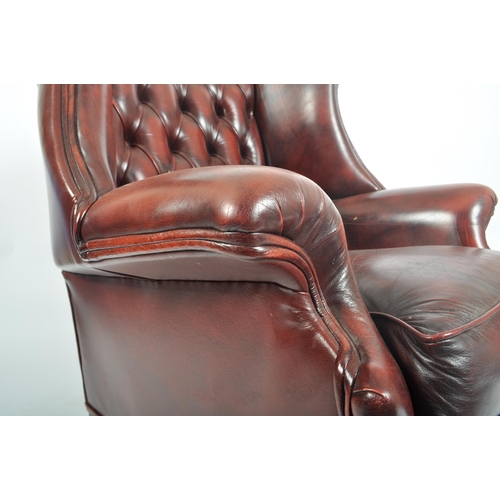 137 - A vintage 20th century Chesterfield style Queen Anne Revival wingback ox blood leatherette armchair ... 