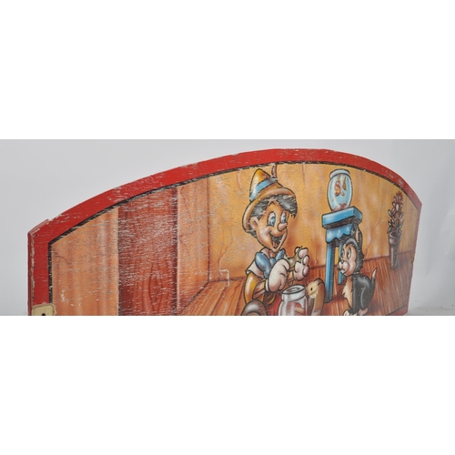 141 - A contemporary well weathered painted wooden fairground / funfair panel featuring Disney's Pinocchio... 