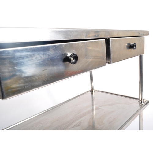 148 - A contemporary medical / industrial three tier stainless steel trolley, having twin drawer fitted fr... 