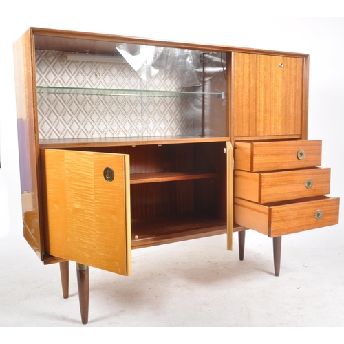 158 - A retro vintage mid 20th century walnut veneered cocktail cabinet highboard having a glazed sliding ... 