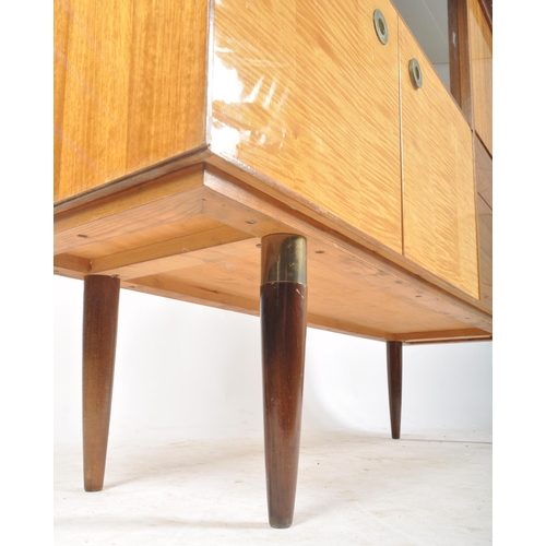 158 - A retro vintage mid 20th century walnut veneered cocktail cabinet highboard having a glazed sliding ... 