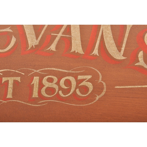 159 - A contemporary hand painted wooden sign having red, blue and cream lettering on brown finished groun... 