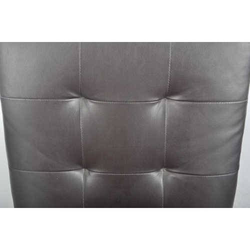 188 - A contemporary dark brown leather swivel lounge chair / lobby chair having removable button backed s... 