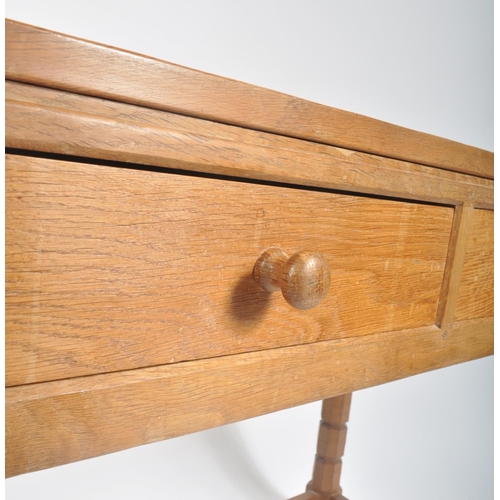 2 - Robert ' Mouseman ' Thompson of Kilburn - A solid English oak hand carved two drawer hall side table... 