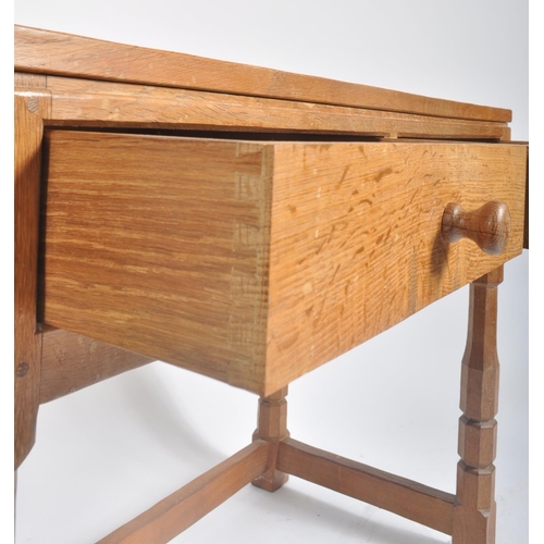 2 - Robert ' Mouseman ' Thompson of Kilburn - A solid English oak hand carved two drawer hall side table... 