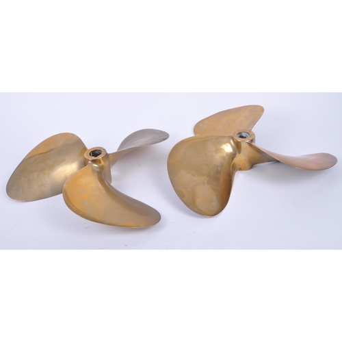 22 - A pair of 20th century solid bronze boat propeller / ship's propellers, each having three-bladed des... 