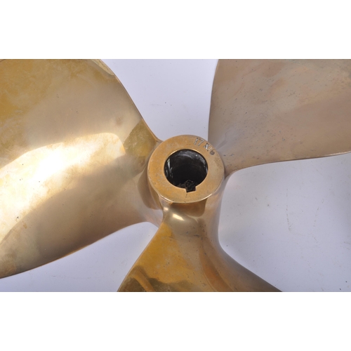 22 - A pair of 20th century solid bronze boat propeller / ship's propellers, each having three-bladed des... 