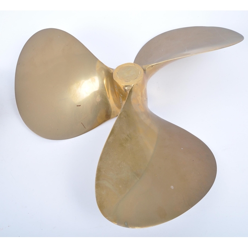 22 - A pair of 20th century solid bronze boat propeller / ship's propellers, each having three-bladed des... 