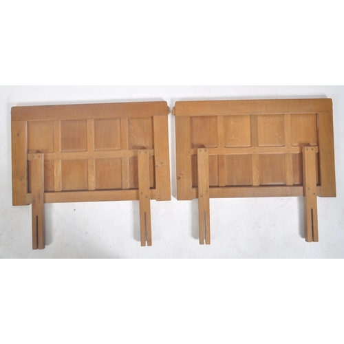 24 - Robert ' Mouseman ' Thompson of Kilburn - A pair of solid English oak hand carved single headboards.... 