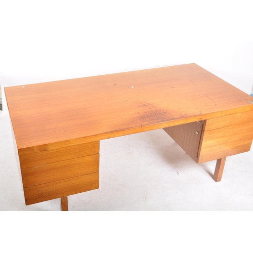 245 - Gordon Russell - A large retro vintage mid 20th century circa 1960s designer teak desk. The desk hav... 