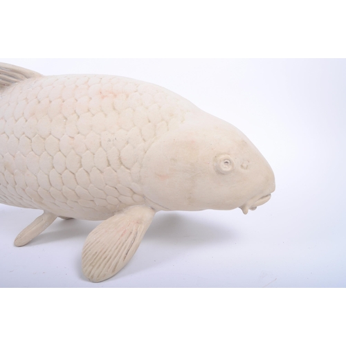 258 - A large contemporary hand moulded gesso / plaster sculpture of koi fish carp. The figure with molded... 